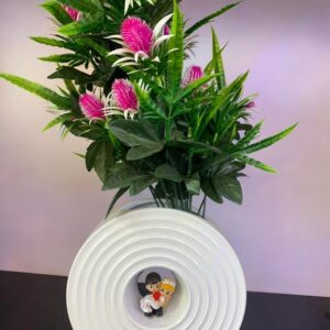 Decorative artificial flower arrangement